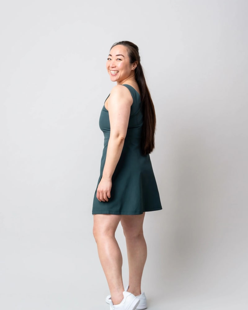 Side of a model wearing a size 3X get dirty dress 2.0 in Forest green by alder apparel. | dia_product_style_image_id:300680